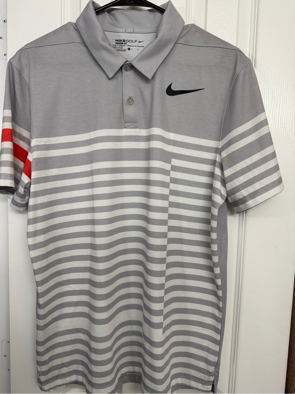 Nike Men’s Grey and White Striped Polo with Black Swoosh and Red Sleeve Accent